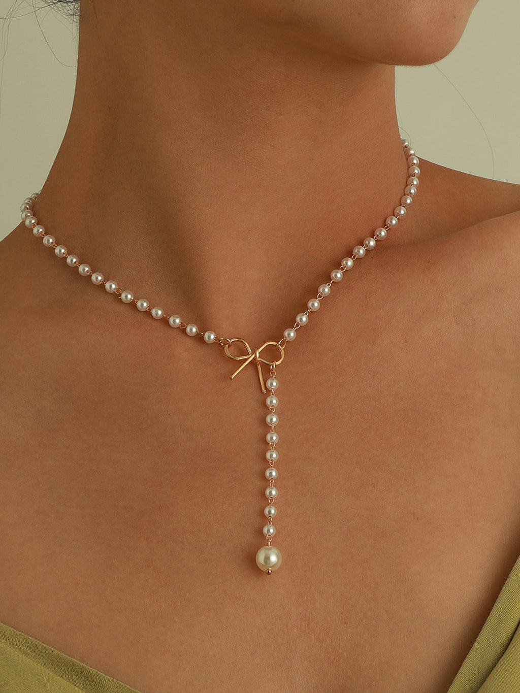 Emma | Exquisite Pearl Bow Necklace with Zirconia Accents 1