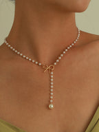 Emma | Exquisite Pearl Bow Necklace with Zirconia Accents 1